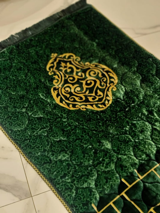 A Green jaynamaz - prayer Mate with a motive design online available at Idara-e-Islamiat, displayed for daily Muslim prayers.
