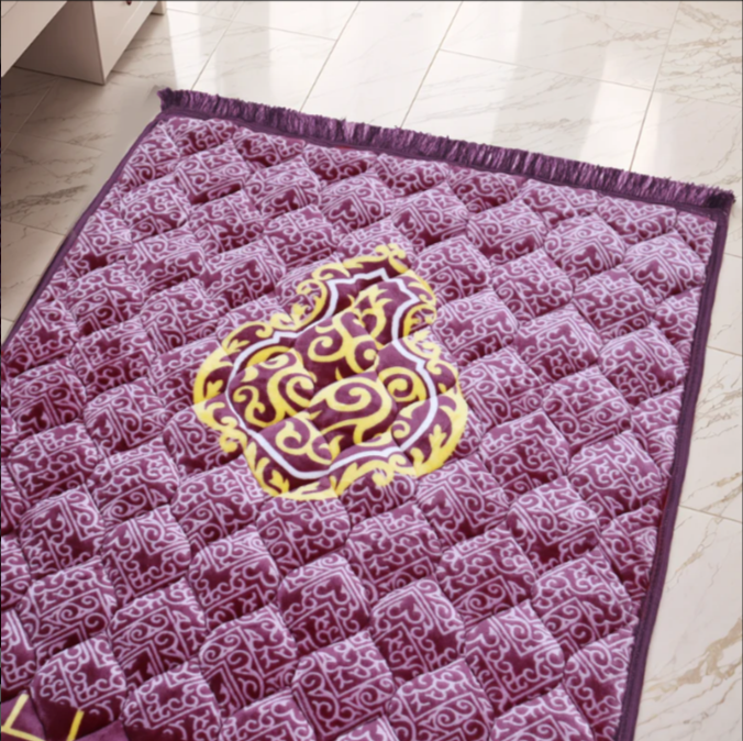 A Purple jaynamaz - prayer Mate with a motive design online available at Idara-e-Islamiat, displayed for daily Muslim prayers. 