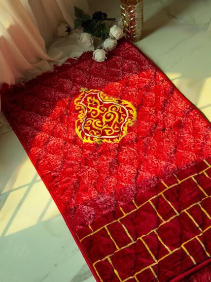 A Red Bridal jaynamaz - prayer Mate with a motive design online available at Idara-e-Islamiat, displayed for daily Muslim prayers. an ideal wedding gift 