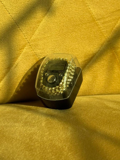 Digital Tasbeeh Counter with Box with hand made fancy crystal stone work  on a beige fabric background