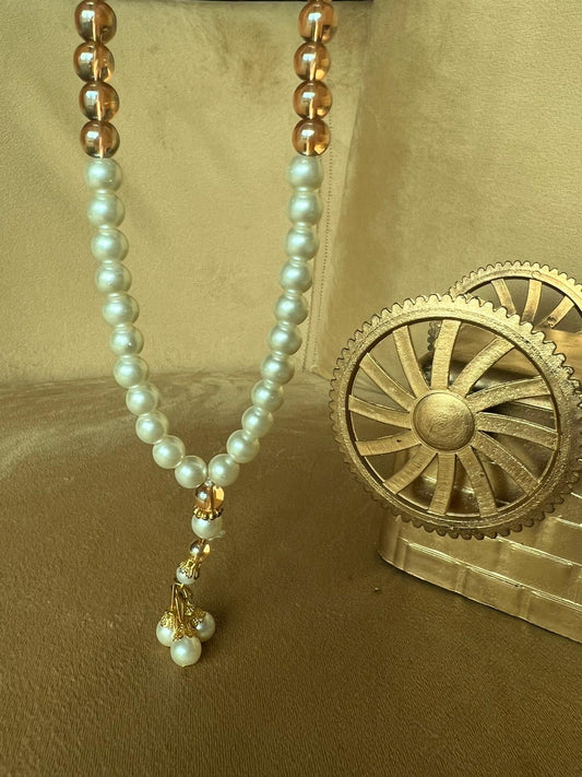 A premium Tasbeeh with white pearl-like beads and gold-tone accents, 100 beads and Quality materials.