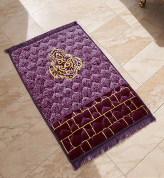 A purple jaynamaz - prayer Mate with a motive design online available at Idara-e-Islamiat, displayed for daily Muslim prayers. 
