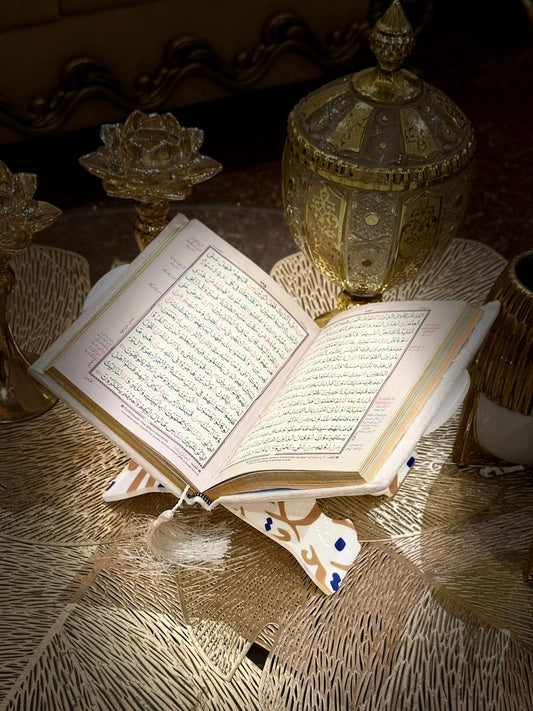 White Acrylic Quran Rehal Stand by Idara-e-islamiat is assembled, while Velvet Tajweedi Quran is opened & placed over the rehal ready for Quran recitation 